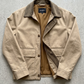 Beige jacket with brown collar and interior on a gray background