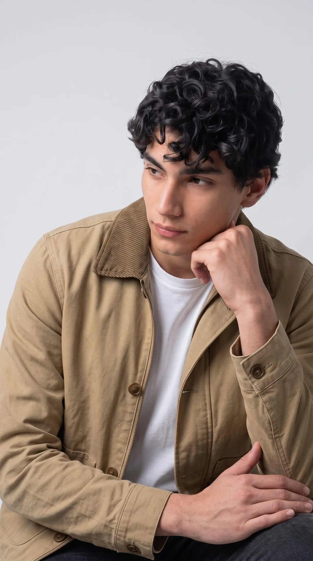 Close-up of premium breathable beige cotton fabric weave and high-quality neat stitching on the jacket collar.
