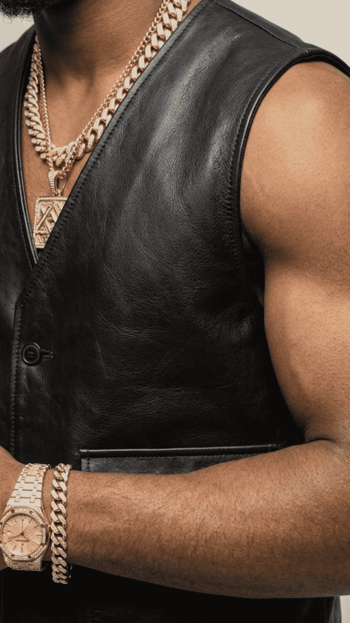Close-up shot showcasing the sleek premium black leather texture and tightly stitched matching front buttons on a luxury vest.