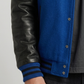 Close-up shot showcasing the velvety royal blue suede body fabric paired with smooth premium black leather sleeves.