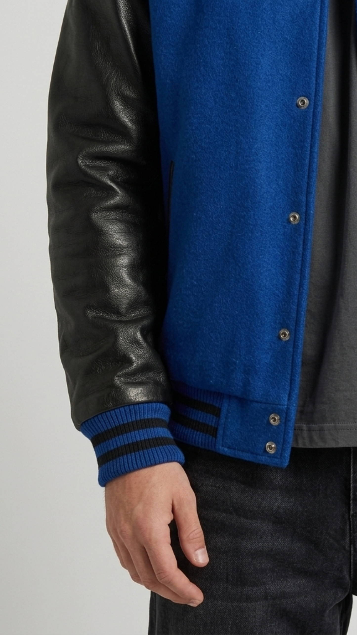 Close-up shot showcasing the velvety royal blue suede body fabric paired with smooth premium black leather sleeves.