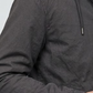 Close-up shot highlighting the soft matte texture of a high-quality charcoal grey silk cotton blend fabric and neat seams.