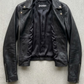 Authentic Jackero brand black leather biker jacket displayed on a clean studio backdrop, emphasizing durable outerwear craftsmanship.