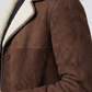 Close-up shot showing the rich, velvety texture of dark chocolate brown suede contrasted against soft white shearling lining.