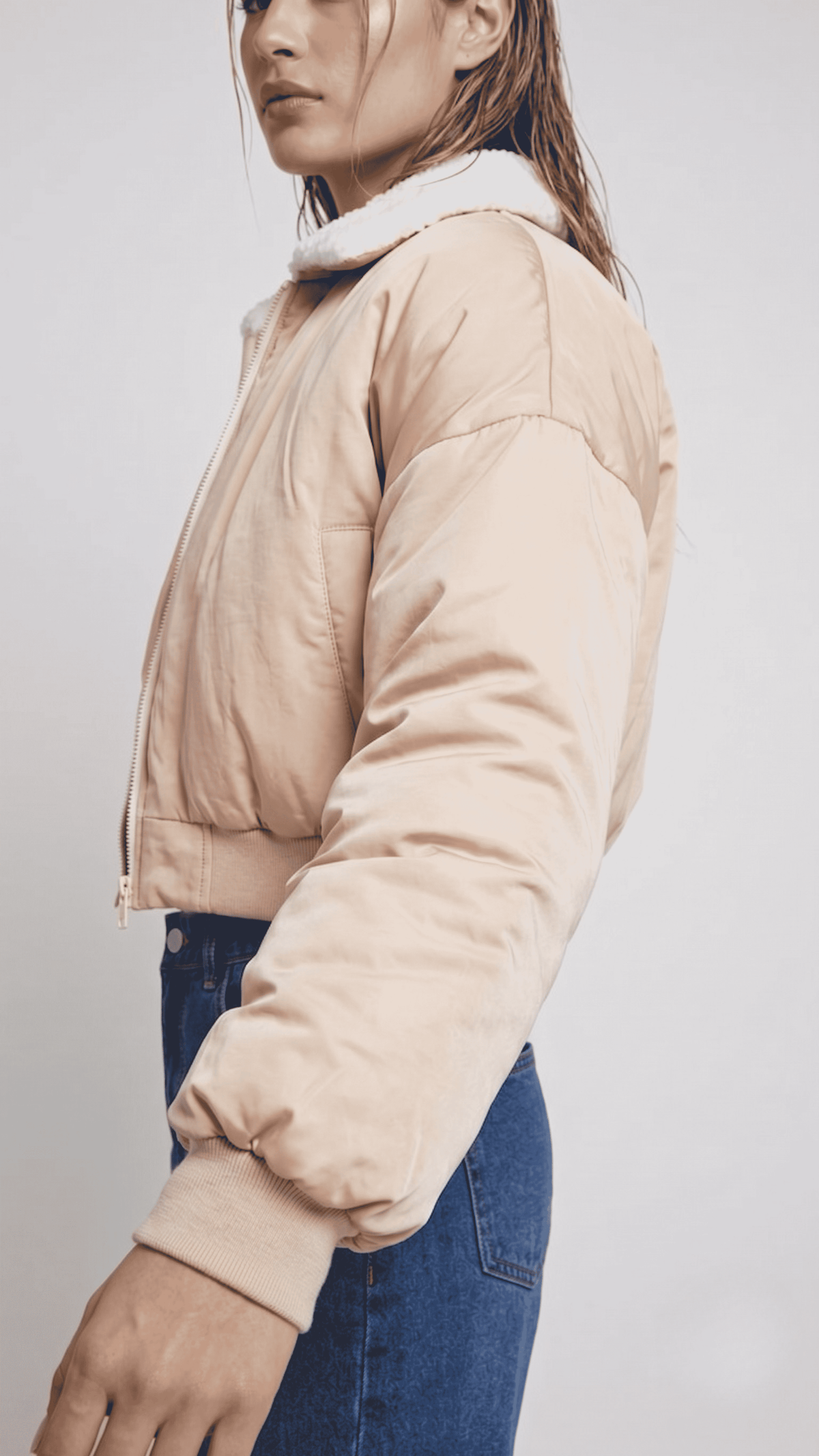 Close-up shot showcasing the delicate weave, soft cream texture, and luxury premium sheen of a high-quality light beige silk cotton blend fabric.
