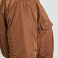 Close-up shot showcasing the soft weave and luxury premium sheen of a high-quality tan silk cotton blend fabric.