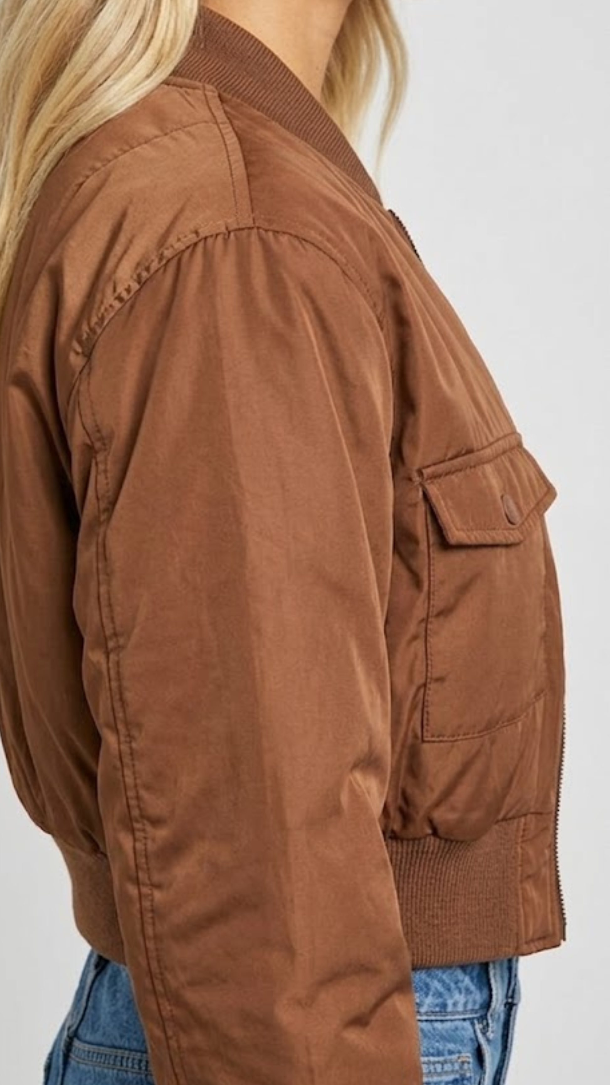 Close-up shot showcasing the soft weave and luxury premium sheen of a high-quality tan silk cotton blend fabric.