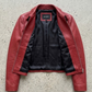 Jackero jacket flat lay photography of a high-end crimson red leather café racer coat displayed on a solid grey backdrop.
