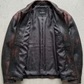Clean jackero jacket catalog flat lay of a premium black leather button-down trucker outerwear on a solid grey backdrop.