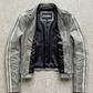 Jackero jacket flat lay photography of a high-end vintage wash grey leather coat displayed symmetrically on a solid neutral background.