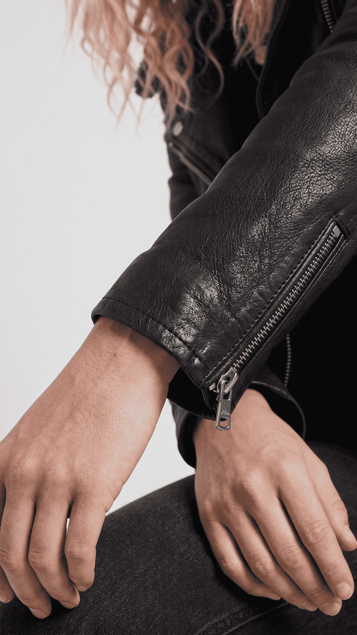Close-up shot highlighting the ultra-premium top-grade black leather texture, deep black dye, and heavy metallic hardware studs.