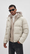 Brave the chill in ultimate street style with the Jackero white puffer jacket, featuring a luxurious fur-trimmed hood for that perfect cold-weather streetwear aesthetic.