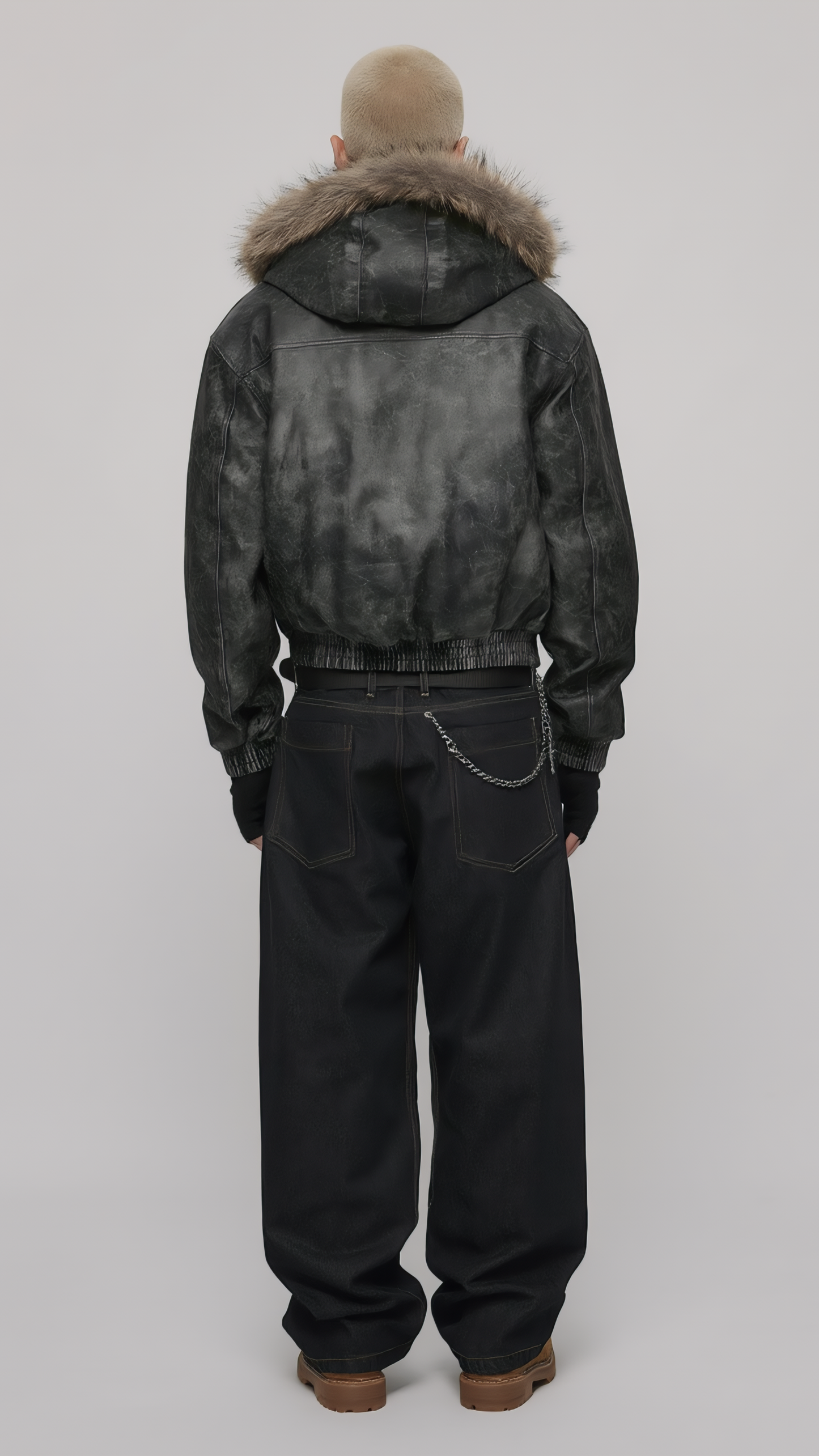 Model wearing a black distressed leather jacket with fur hood styled for a cyber Y2K fashion lookbook.