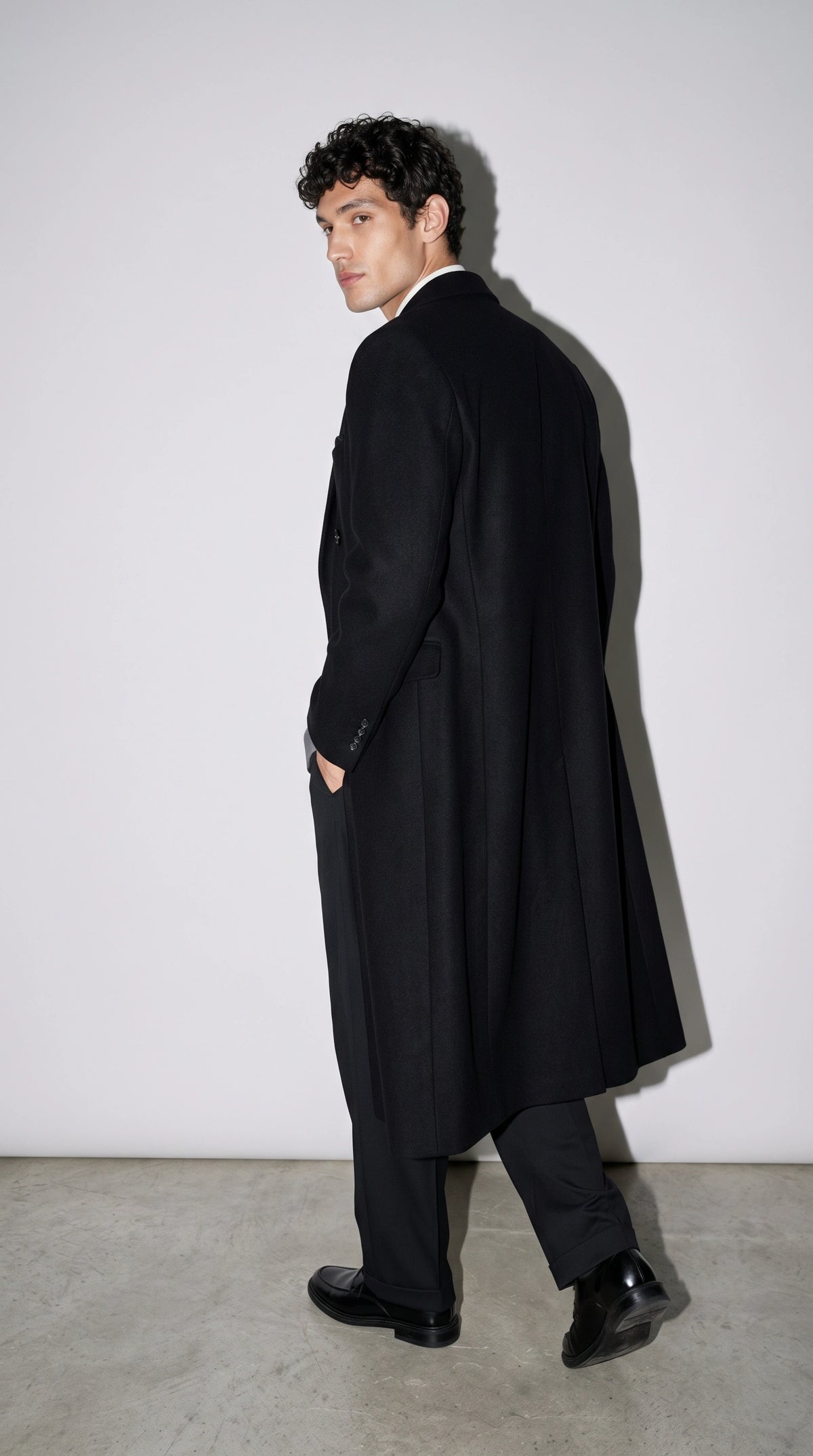 jackero-chic-black-longline-wool-outerwear-sophisticated-streetwear.webp
