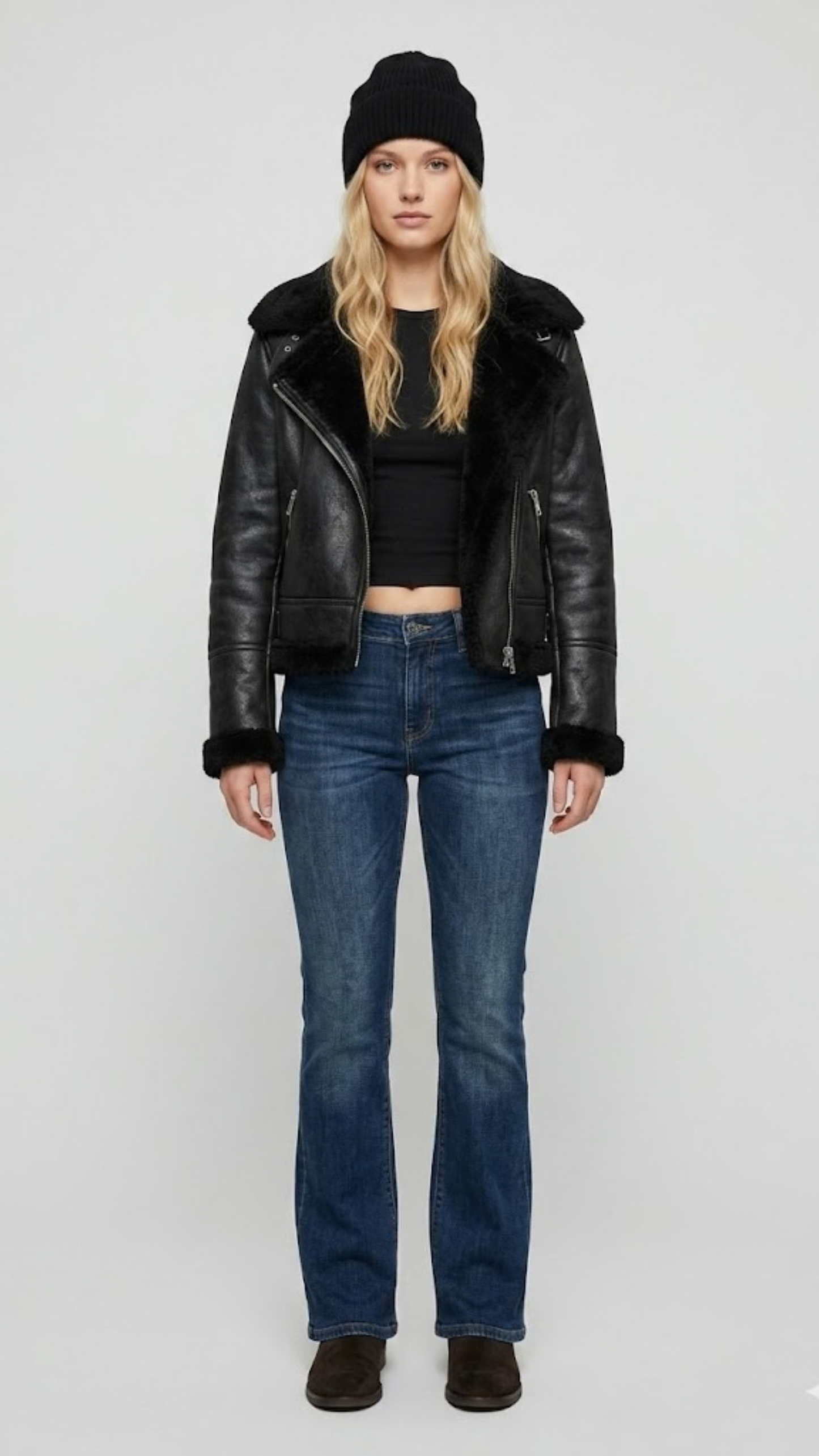 Premium black leather jacket featuring a contrasting white faux shearling collar by Jackero, clean studio front shot.