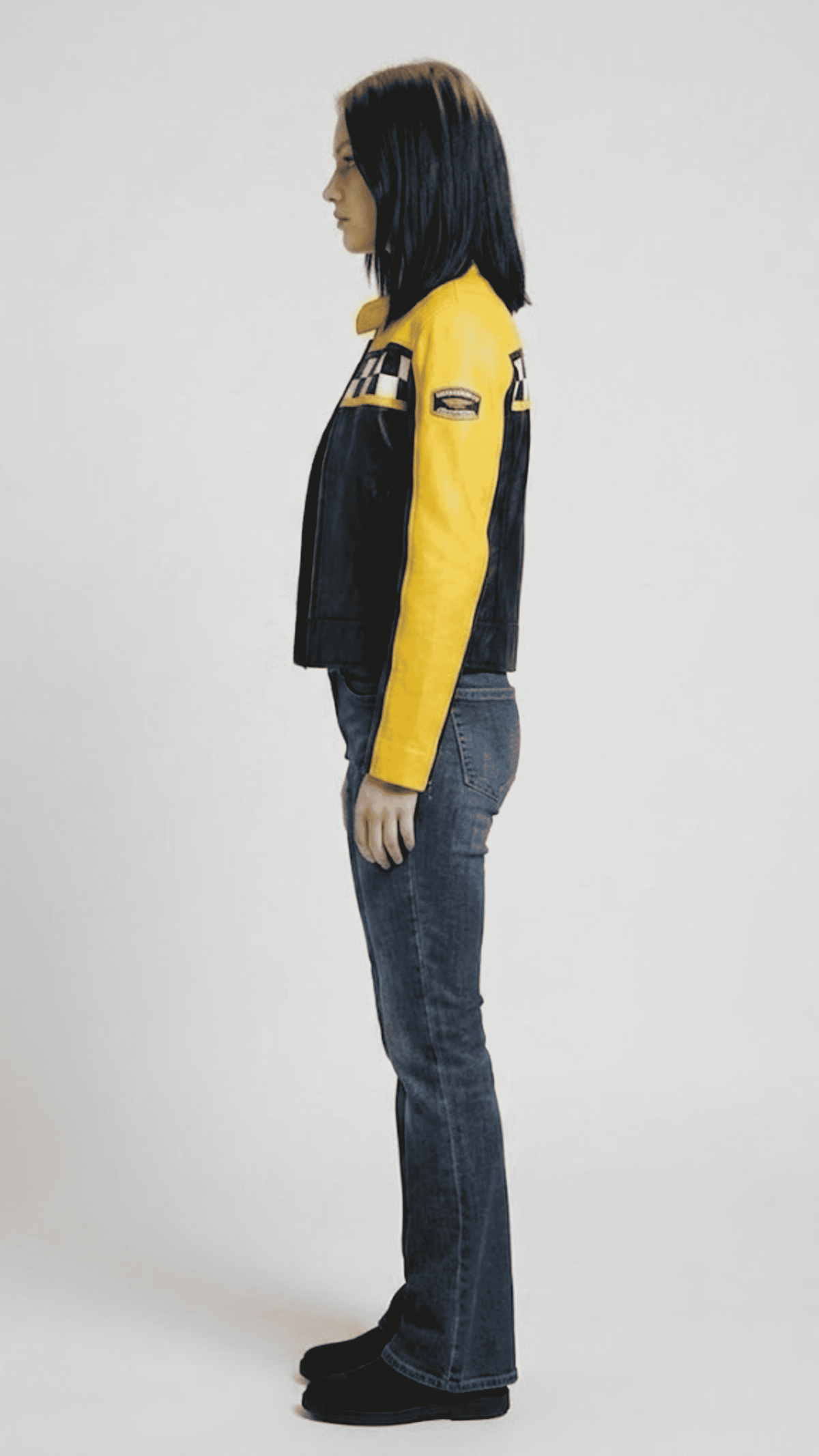 Model wearing a sporty black and yellow genuine leather motorcycle jacket for a sleek, modern streetwear aesthetic.