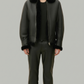 Dark black leather jacket by jackero with a plush white shearling collar shown from the front view.