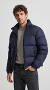 Command the city streets this winter with the Jackero dark navy blue puffer jacket, offering a sleek, modern streetwear aesthetic and unmatched thermal comfort for your daily grind.
