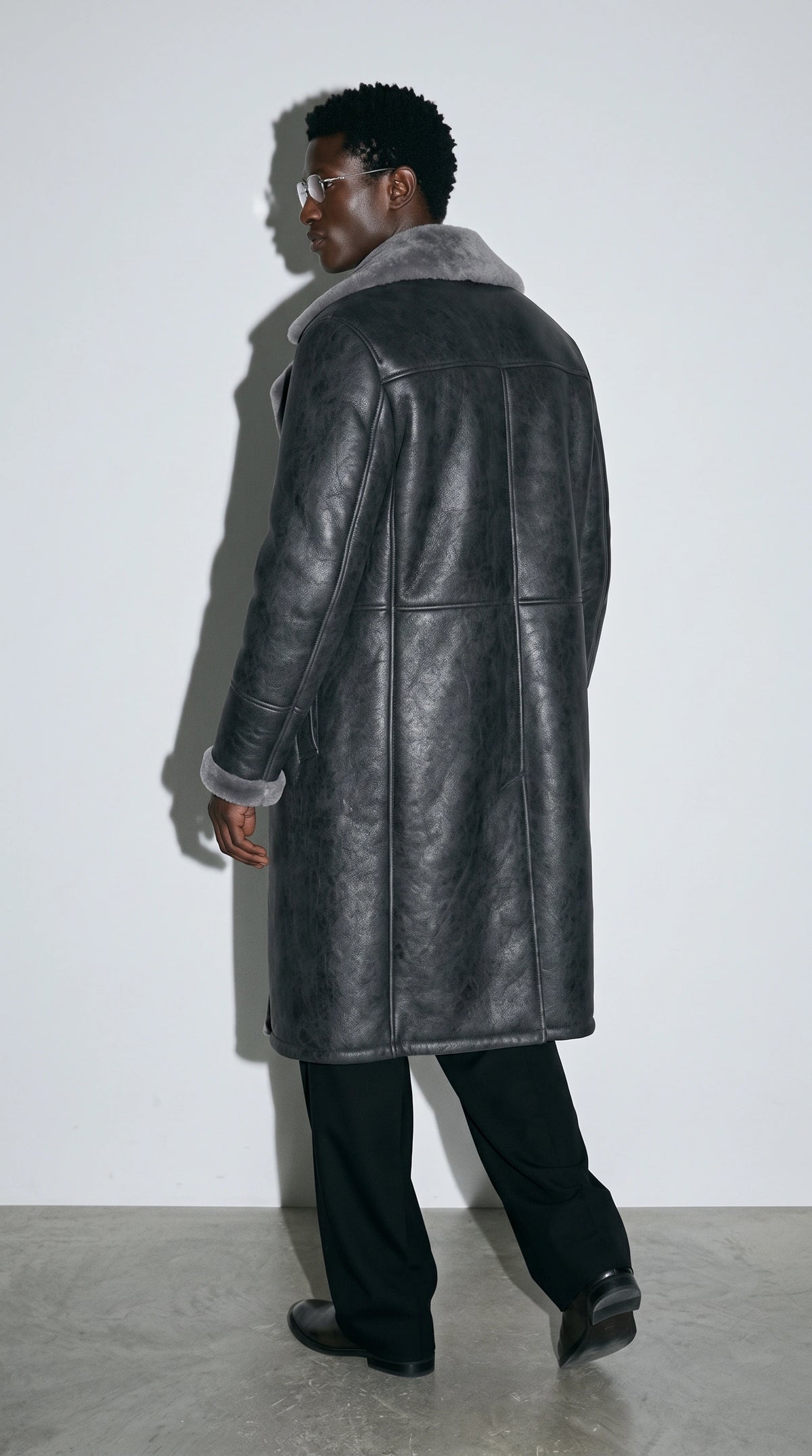 Wrap up against the frost in unparalleled style with this Jackero slate grey faux shearling leather overcoat, heavily influenced by underground streetwear trends for a deeply engaging fashion statement.