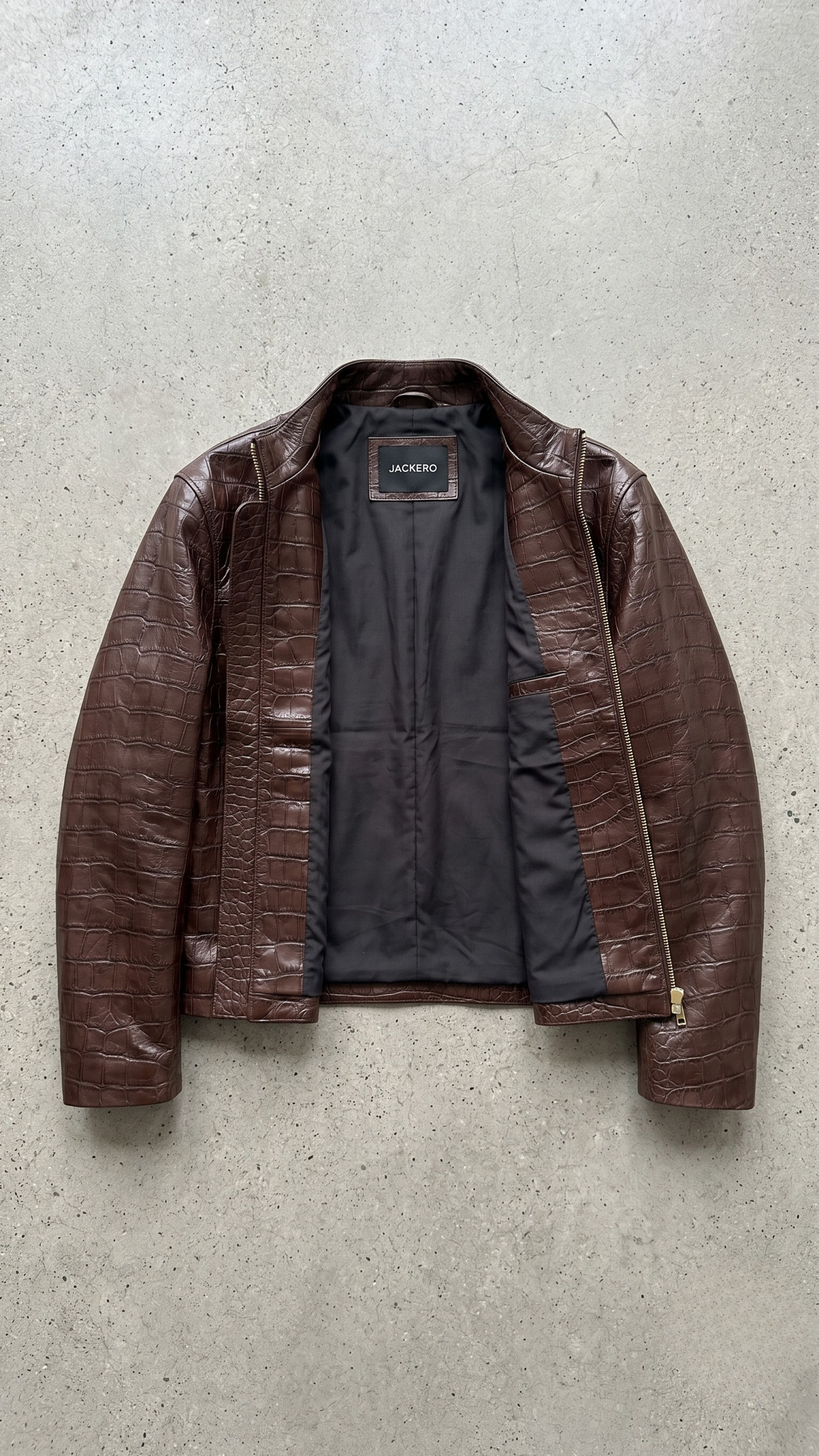 high-quality dark brown crocodile embossed leather material showing the detailed texture and patterns.