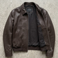 smooth texture and rich deep espresso color on a genuine chocolate brown leather jacket.