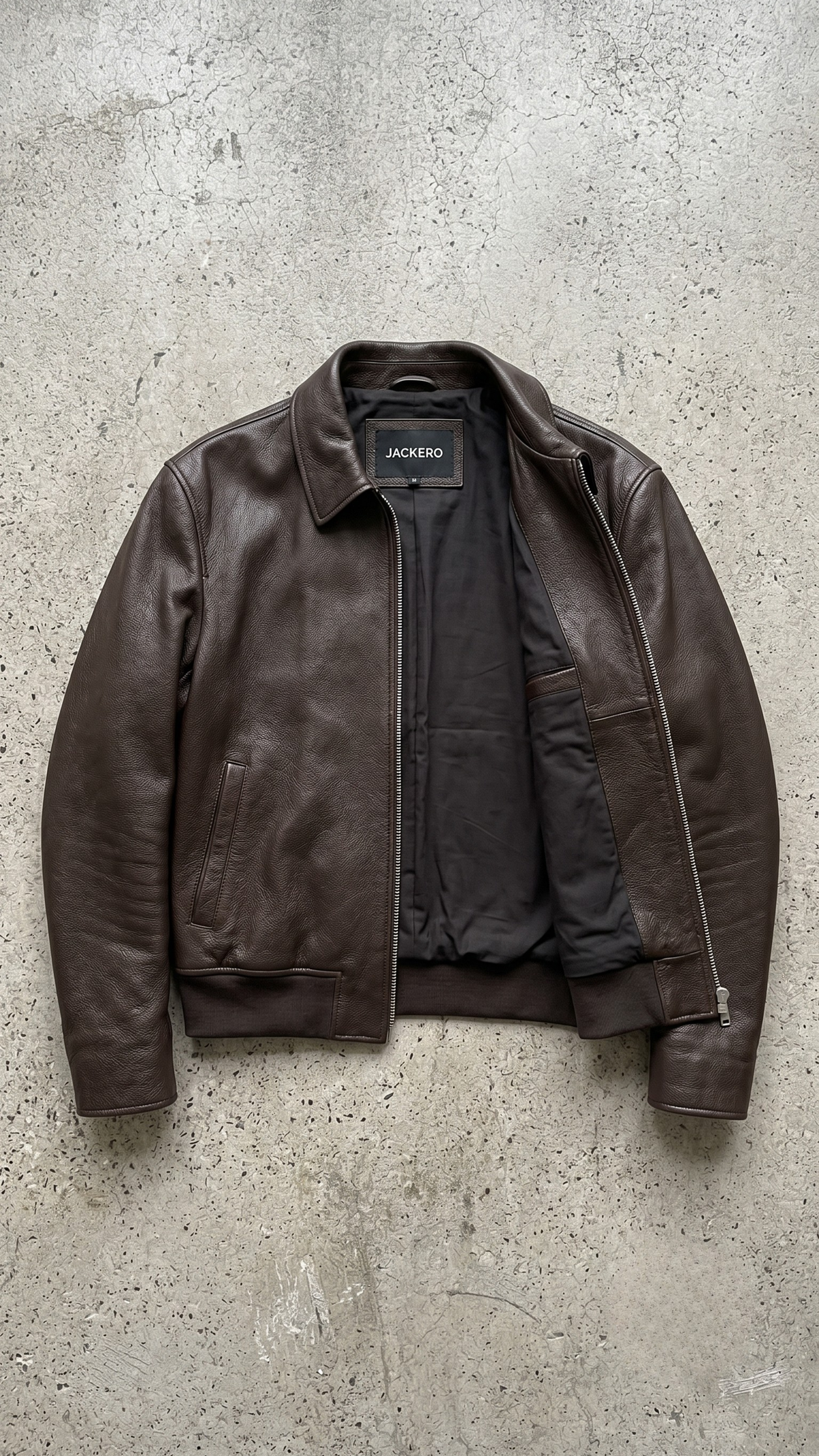 smooth texture and rich deep espresso color on a genuine chocolate brown leather jacket.
