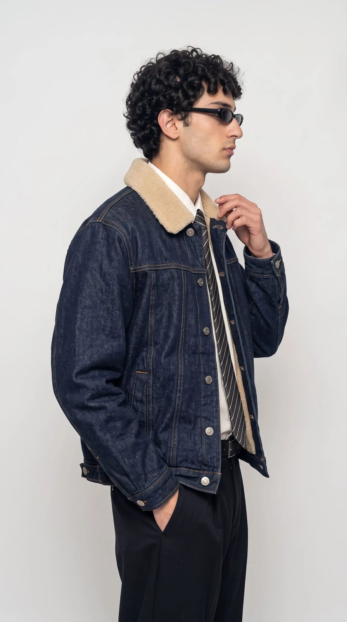 Upgrade your winter street style with this Jackero navy indigo denim outerwear, showcasing a luxurious and soft shearling collar that turns an everyday outfit into an engaging streetwear statement.