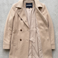 Jackero beige soft cotton long coat presented flawlessly on a clean, minimalist studio backdrop.