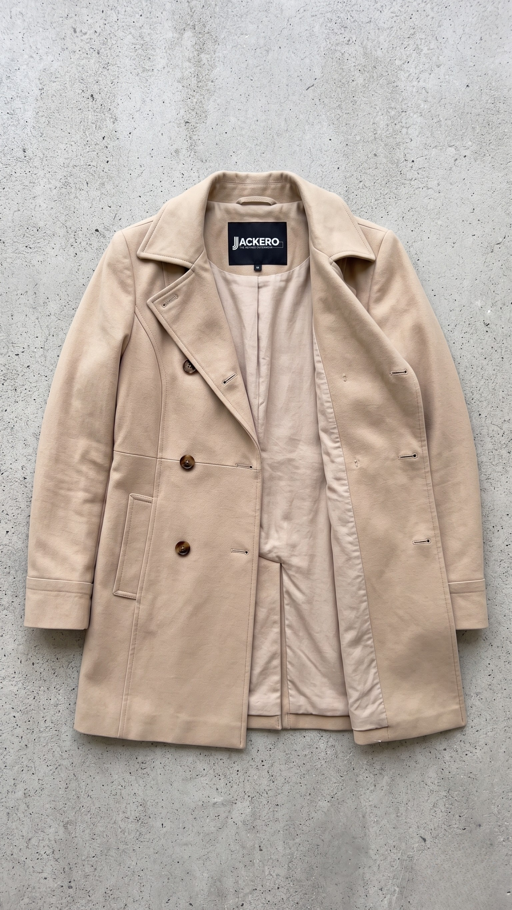 Jackero beige soft cotton long coat presented flawlessly on a clean, minimalist studio backdrop.