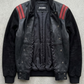 Jackero black and red leather bomber outerwear beautifully presented against a clean, minimalist studio backdrop.