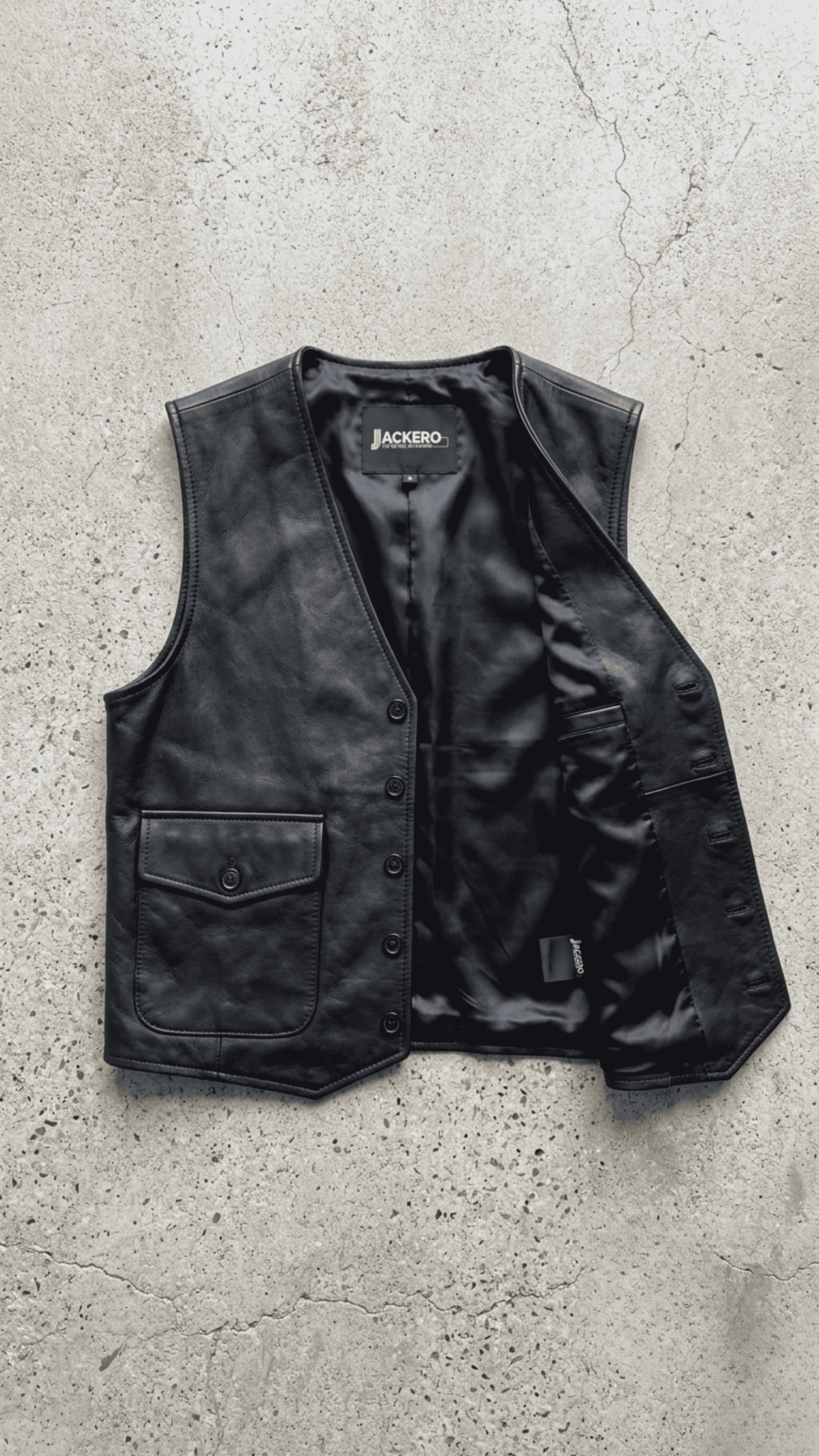 Jackero premium button up black leather vest outerwear beautifully presented against a clean, minimalist studio backdrop.