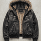 Jackero contemporary Y2K dark black leather baggy oversized jacket with brown fur presented against a clean, minimalist studio backdrop.