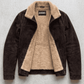Jackero dark chocolate brown suede jacket with premium white shearling lining displayed beautifully against a minimalist studio backdrop.