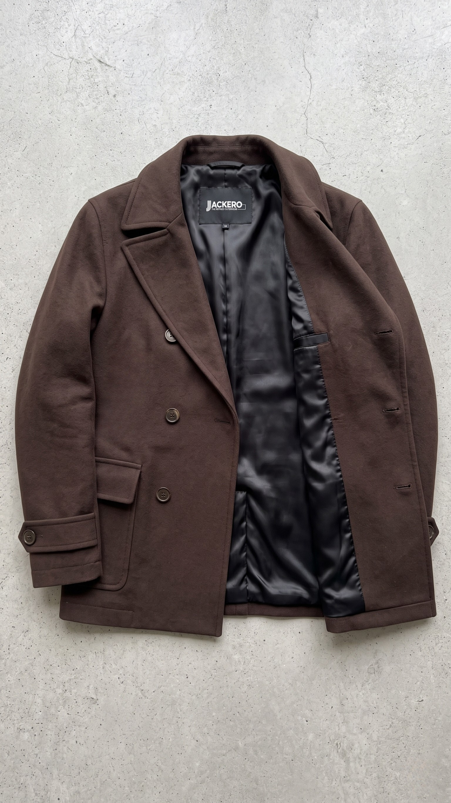 Jackero dark chocolate brown wool overcoat beautifully presented against a clean, minimalist studio backdrop.