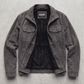 Jackero dark grey utility suede multi-pocket jacket beautifully displayed against a clean, minimalist studio background.