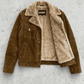 Jackero contemporary dark mustard suede Western jacket with fur presented against a clean, minimalist studio backdrop.
