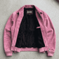 Jackero light pink suede bomber jacket beautifully presented against a clean, minimalist studio backdrop.