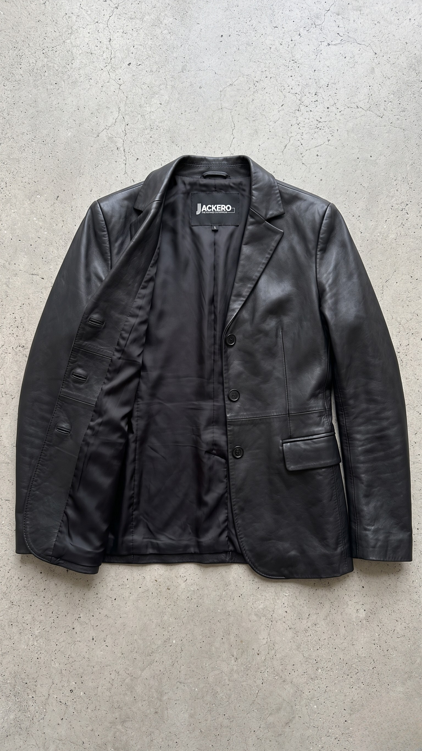Jackero contemporary women's black leather blazer jacket beautifully presented against a clean, minimalist studio backdrop.