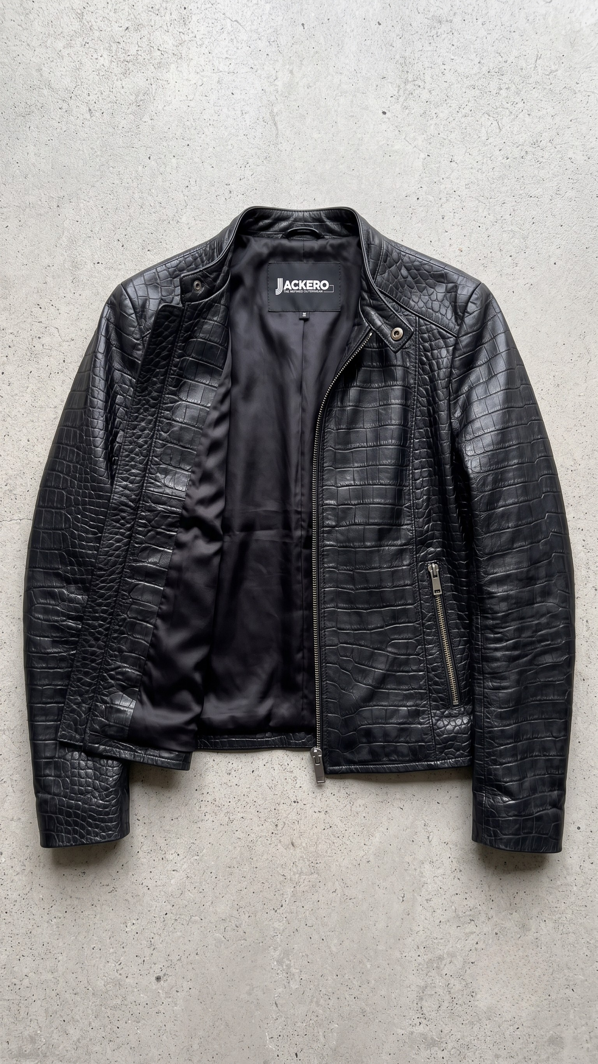 Jackero luxury women's black crocodile embossed leather jacket beautifully presented against a clean, minimalist studio backdrop.