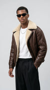 Master the vintage streetwear aesthetic with the Jackero dark brown leather aviator jacket, featuring a thick cream shearling lining that brings classic pilot heritage to modern city fashion.