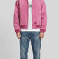 Jackero premium light pink suede bomber jacket featuring a sleek silver zipper and classic rib-knit collar.