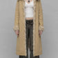 Full-length front view of women wearing a light yellow cotton long over coat with structured front button closures.