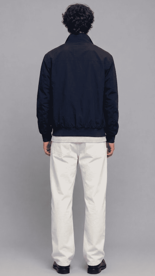Rear view of dark navy blue cotton casual jacket showing clean back shoulder seam and straight hemline