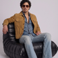 Men's timeless outerwear fashion showcasing a structured tan suede jacket styled effortlessly for a smart-casual look.