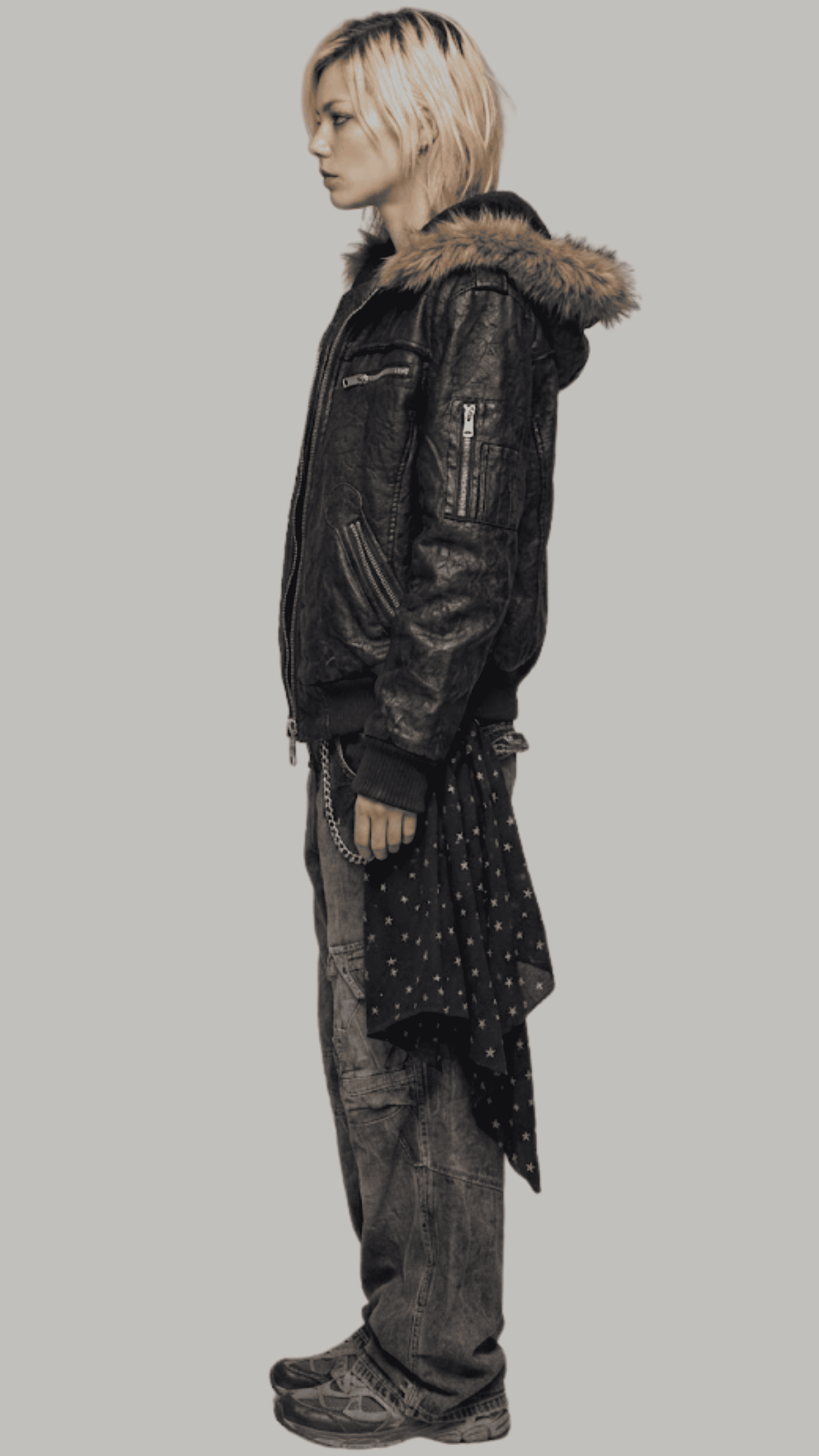 Side profile view displaying the slouchy, comfortable baggy Y2K fit of a men's black leather bomber coat with soft fur lining.