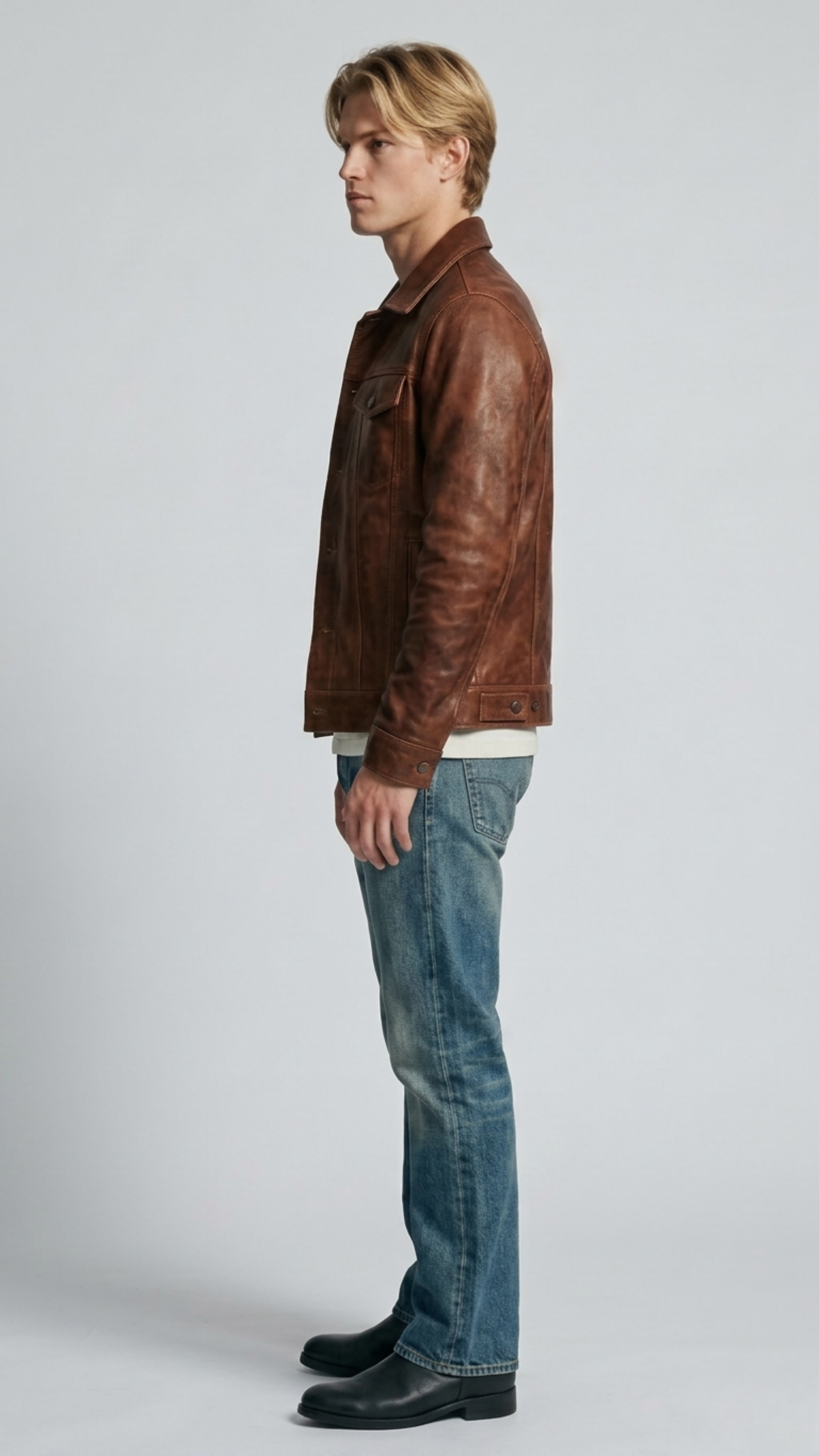 Side angle profile view focusing on the heavy-duty antiqued metallic zippers and reinforced stitch linings of the rustic brown outerwear.