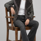 JACKERO Charcoal grey shearling coat featuring dramatic fluffy fur lapels, fur cuffs, and a plush fur hem trim.