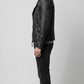 Side angle profile view highlighting the classic wide snap-down lapels and heavy industrial utility details of the premium black outerwear.