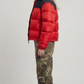 the high-density water-resistant nylon texture and premium insulated horizontal stitch lines of the red and black puffer jacket.