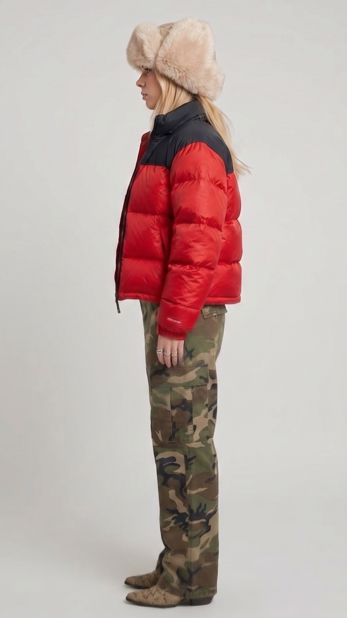 the high-density water-resistant nylon texture and premium insulated horizontal stitch lines of the red and black puffer jacket.